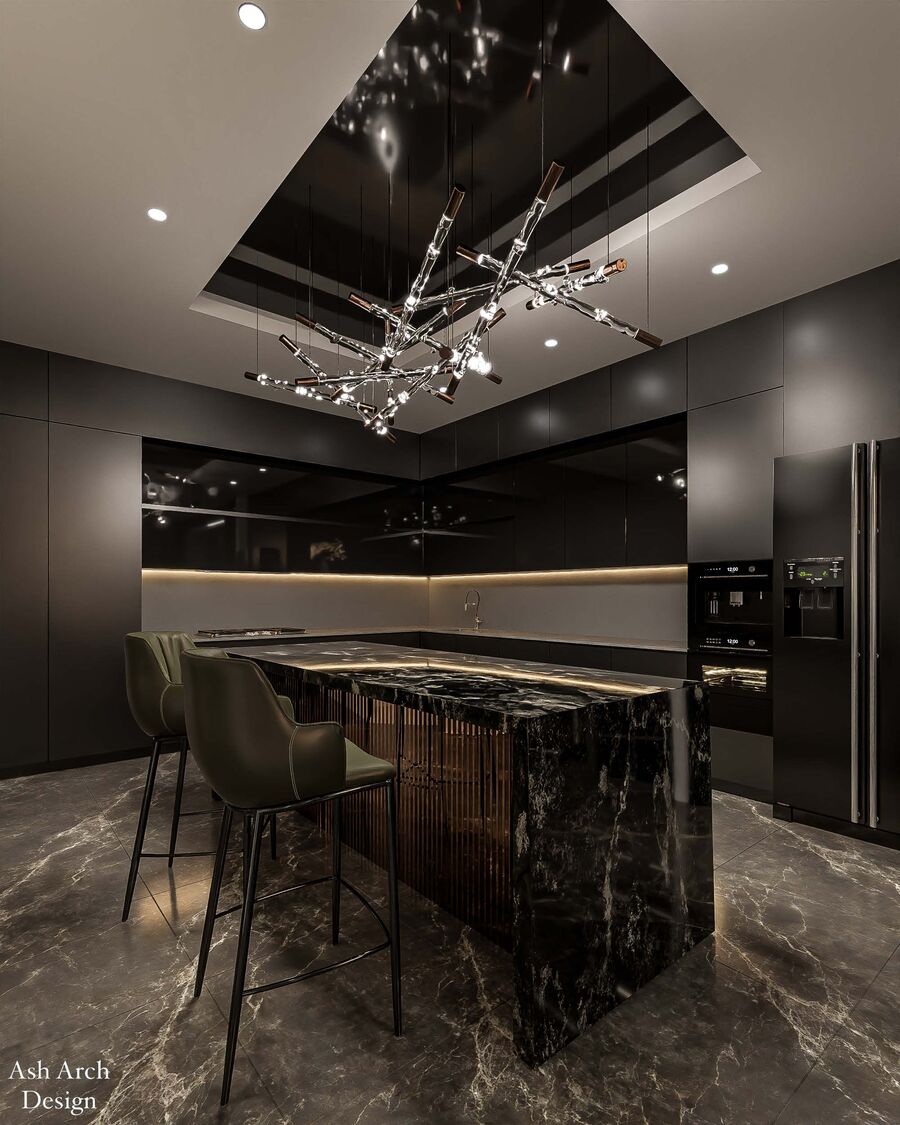 Kitchen — black marble island with bronze reeded base